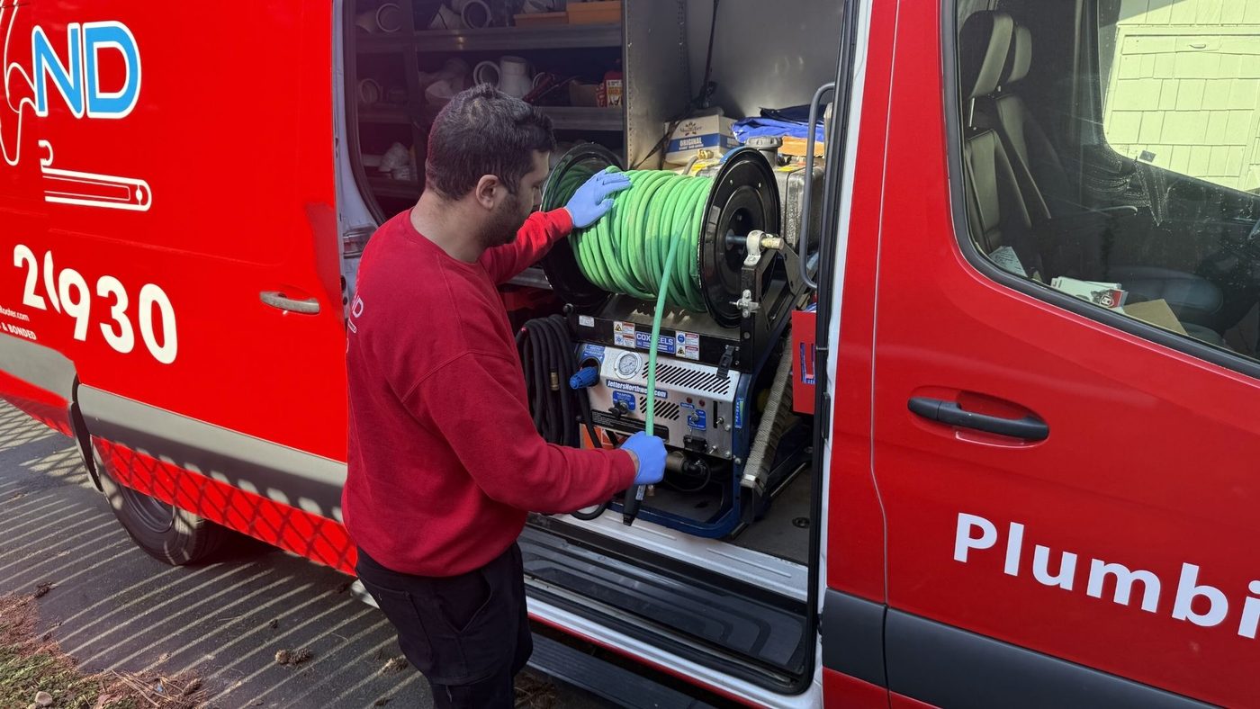 Kirkland Rooter technician working at the van on an Eastside call