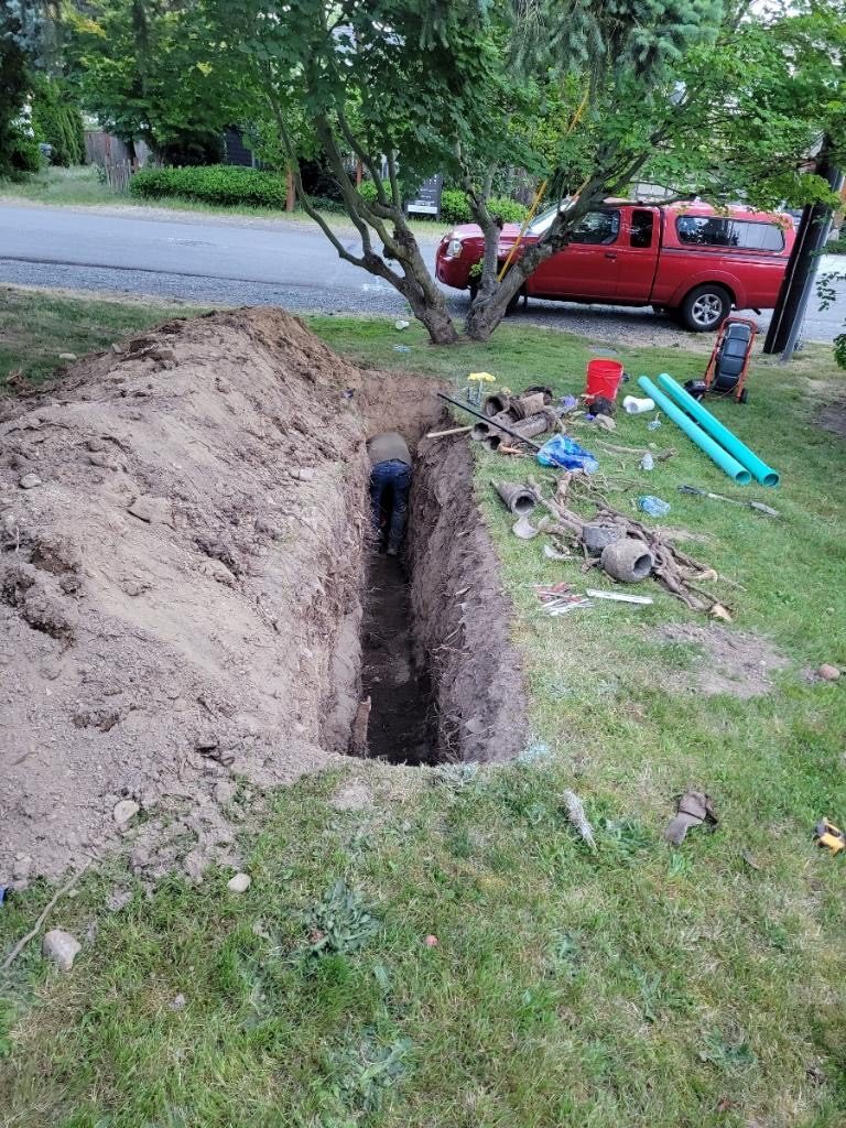 Kirkland Rooter technician working at the van on an Eastside call